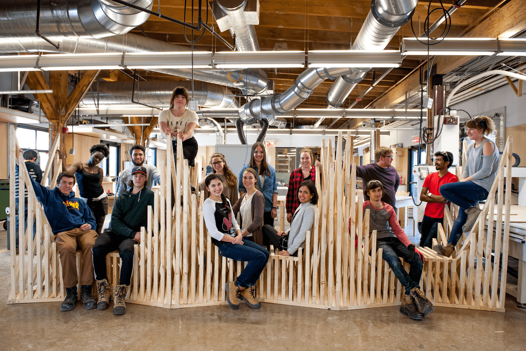 Students around a wooden structure